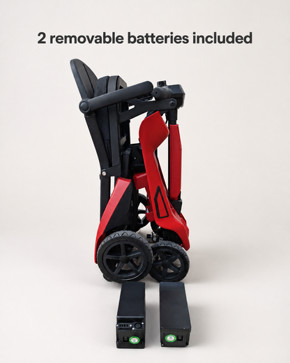 Red AeroGlide mobility scooter folded upright with two removable battery packs positioned in front.
