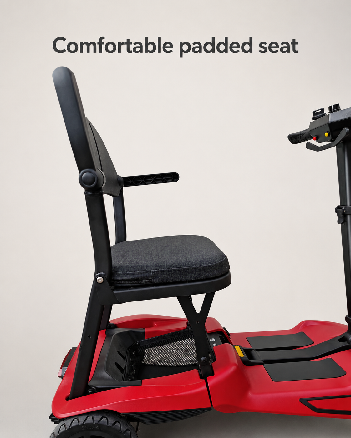 Padded seat and backrest with armrests on the red AeroGlide folding mobility scooter.
