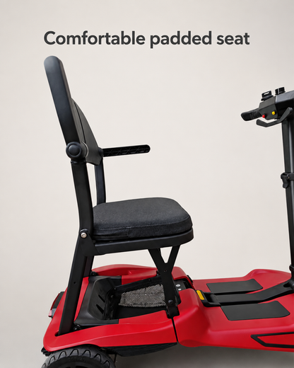 Padded seat and backrest with armrests on the red AeroGlide folding mobility scooter.