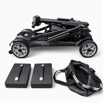 Newbi Move AeroDual folding mobility scooter folded for transport beside two removable lithium batteries and its front basket.