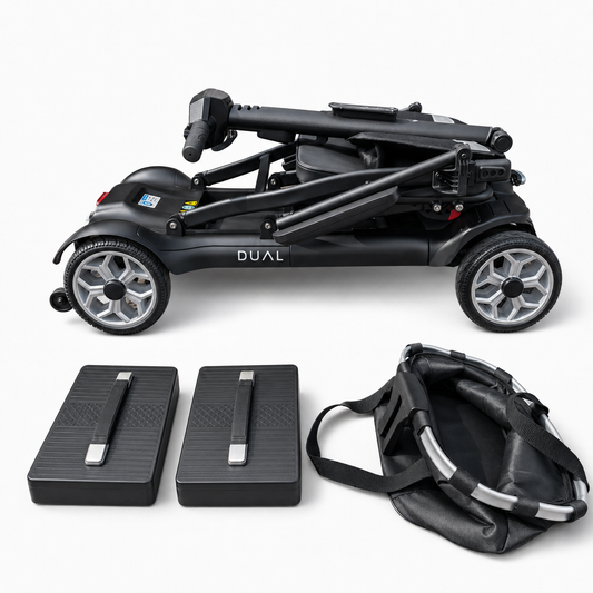 Newbi Move AeroDual folding mobility scooter folded for transport beside two removable lithium batteries and its front basket.