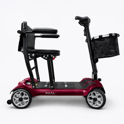 Deep red Newbi Move AeroDual folding mobility scooter shown side-on against a white background.